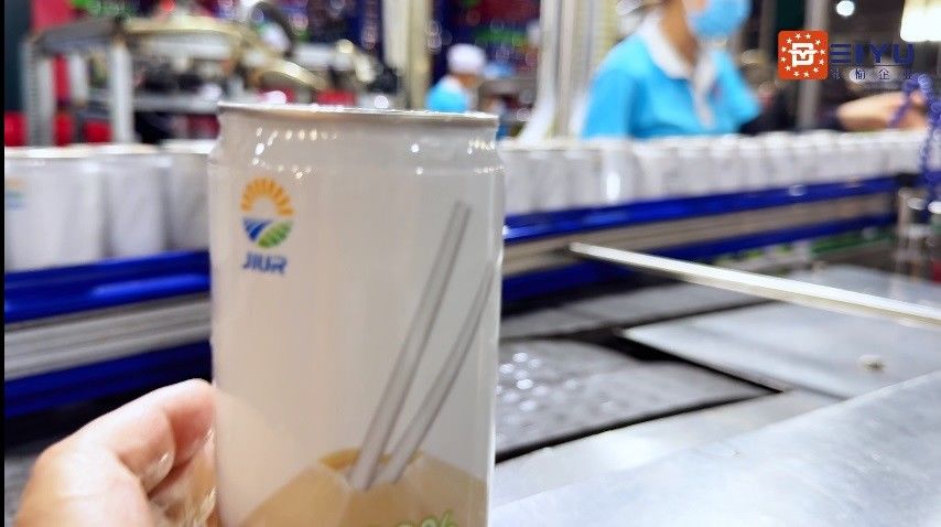 22000 Cans / hour Can Sleeve Labeling Machine Can Sleeve Labeler For Vietnam Coconut Water Beverage Production Line Customer Site