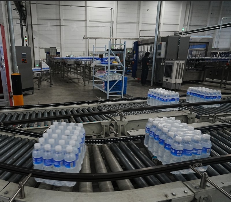 Automated stacking and conveying system for bottled water production High Efficiency Packaging Solution