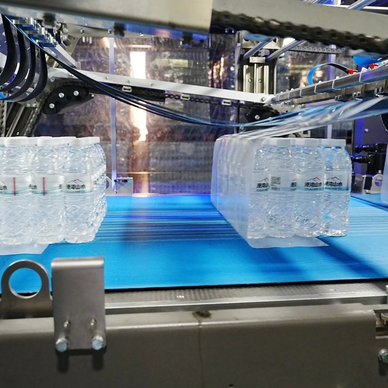 Machine automatique d'emballage à rétrécissement de 25 à 120 paquets/min Capacité 0,6 à 0,8 MPa Pression d'air et hauteur du convoyeur de 1060 mm