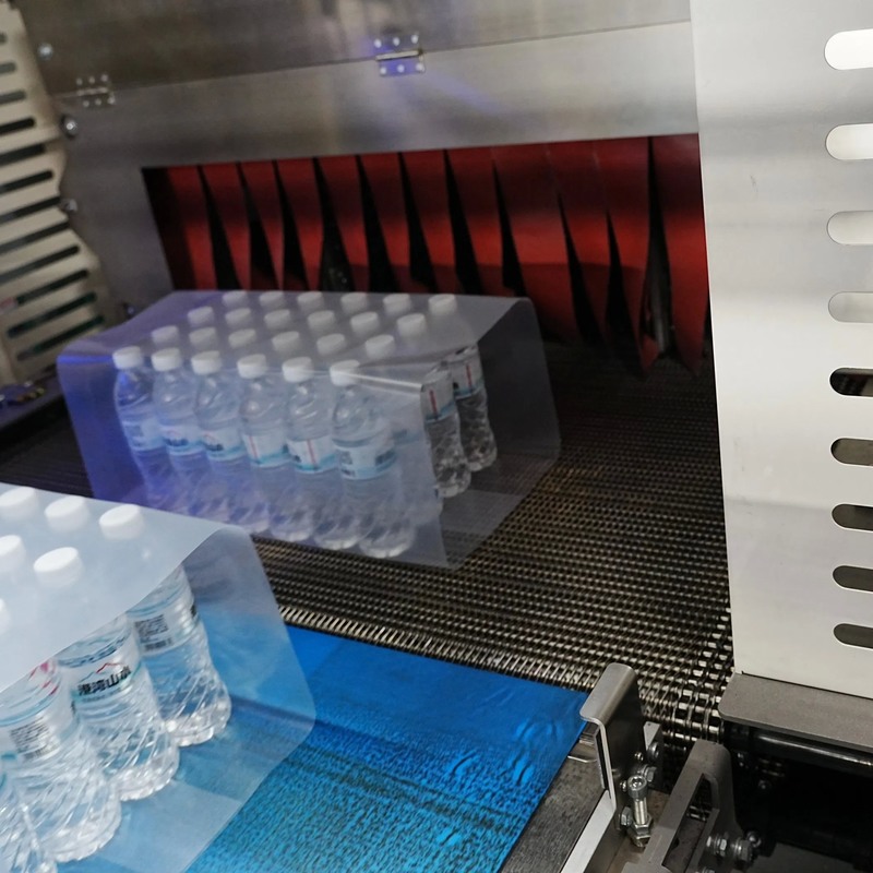 Machine automatique d'emballage à rétrécissement de 25 à 120 paquets/min Capacité 0,6 à 0,8 MPa Pression d'air et hauteur du convoyeur de 1060 mm