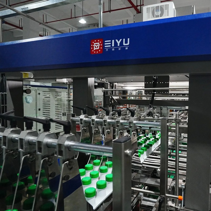 Automatic Wrap Around Carton Case Packer with 25 Cases/minute Speed, Stainless Steel 304 Construction, and AC 380V Power